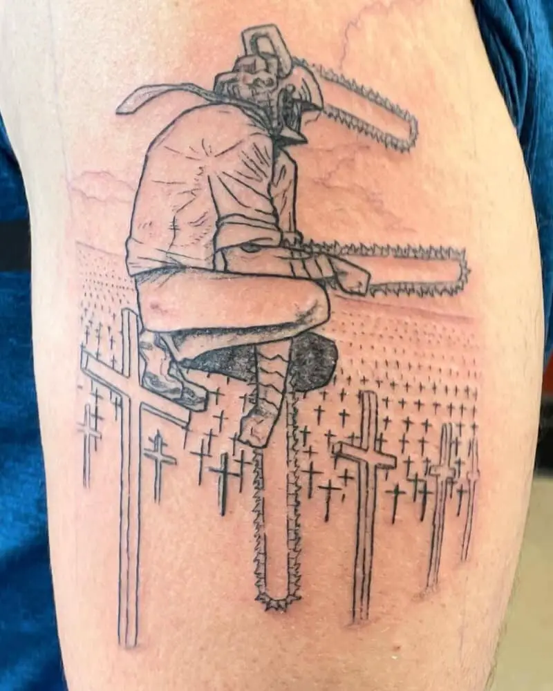 Tattoo of a chainsaw man sitting on a cross in a field of crosses