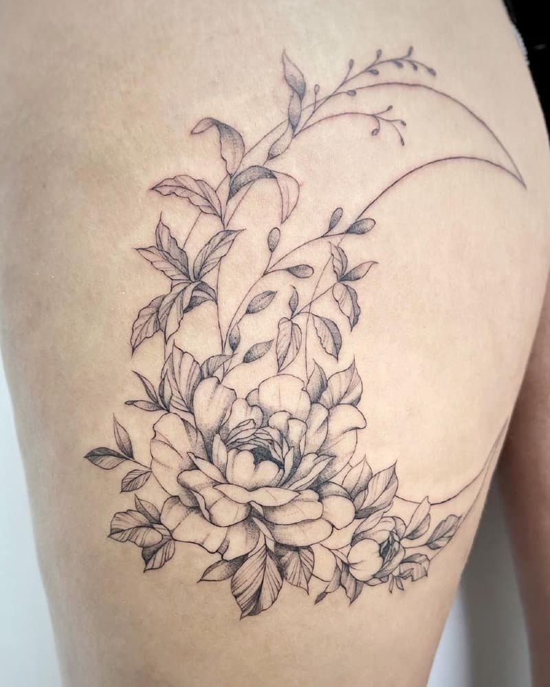 Tattoo of a crescent moon in flowers