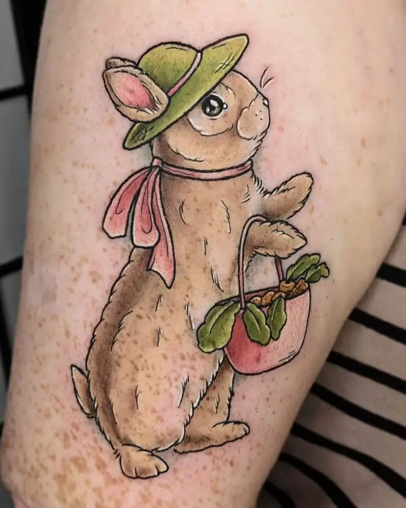 Tattoo of a cute bunny with a hat and a basket full of carrots