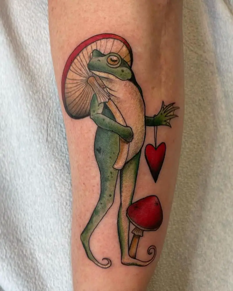 Tattoo of a frog with an umbrella mushroom and a heart
