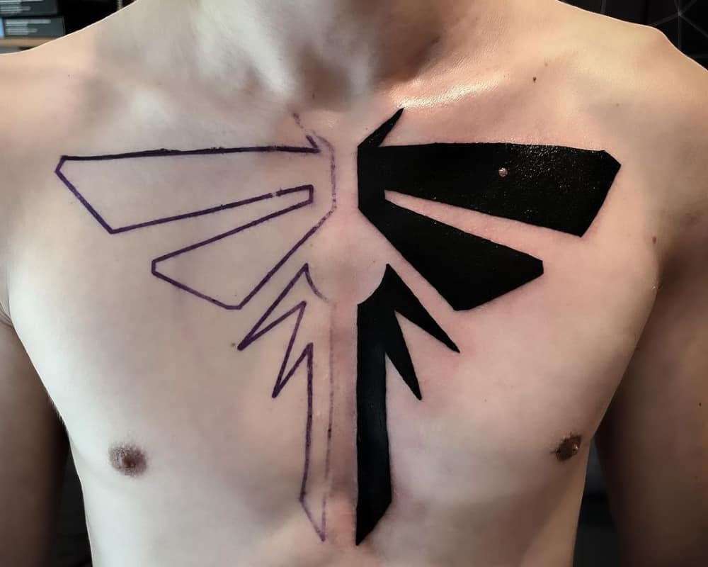 Tattoo of a large black and white cicada sign on the chest