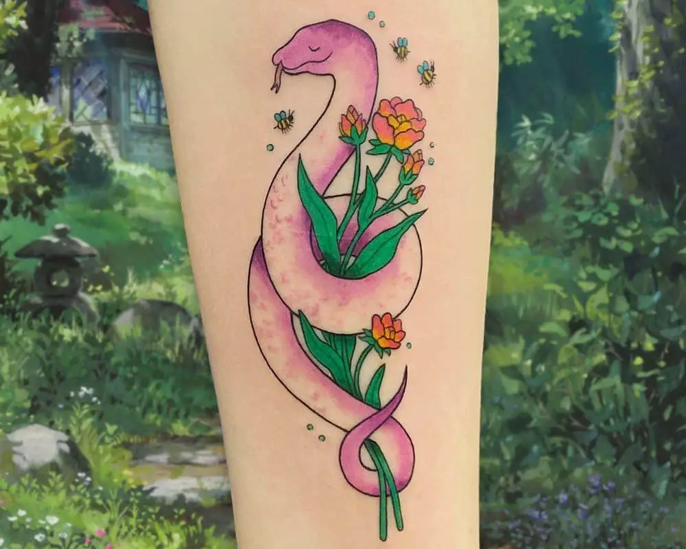 Tattoo of a lilac snake wrapped around flowers