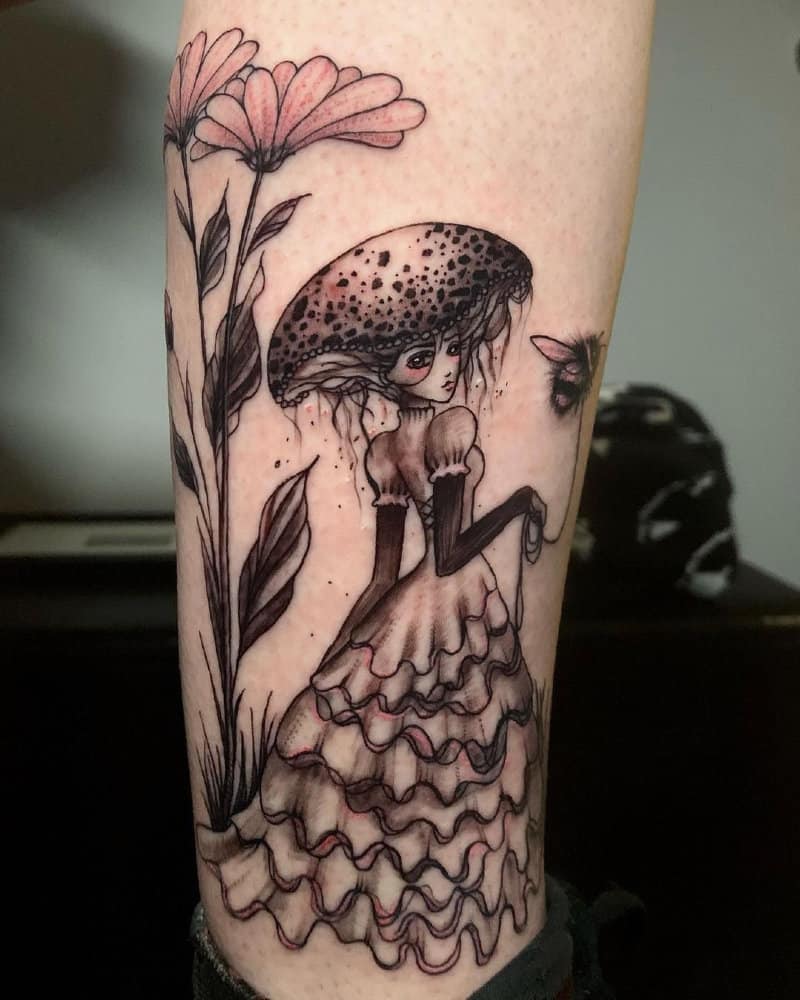 Tattoo of a mushroom girl holding a bumblebee on a string