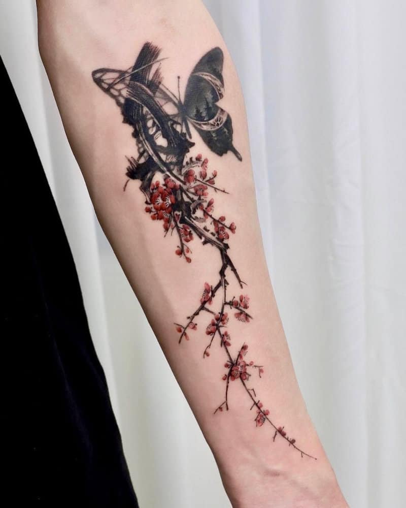 Tattoo of a sakura branch and a butterfly