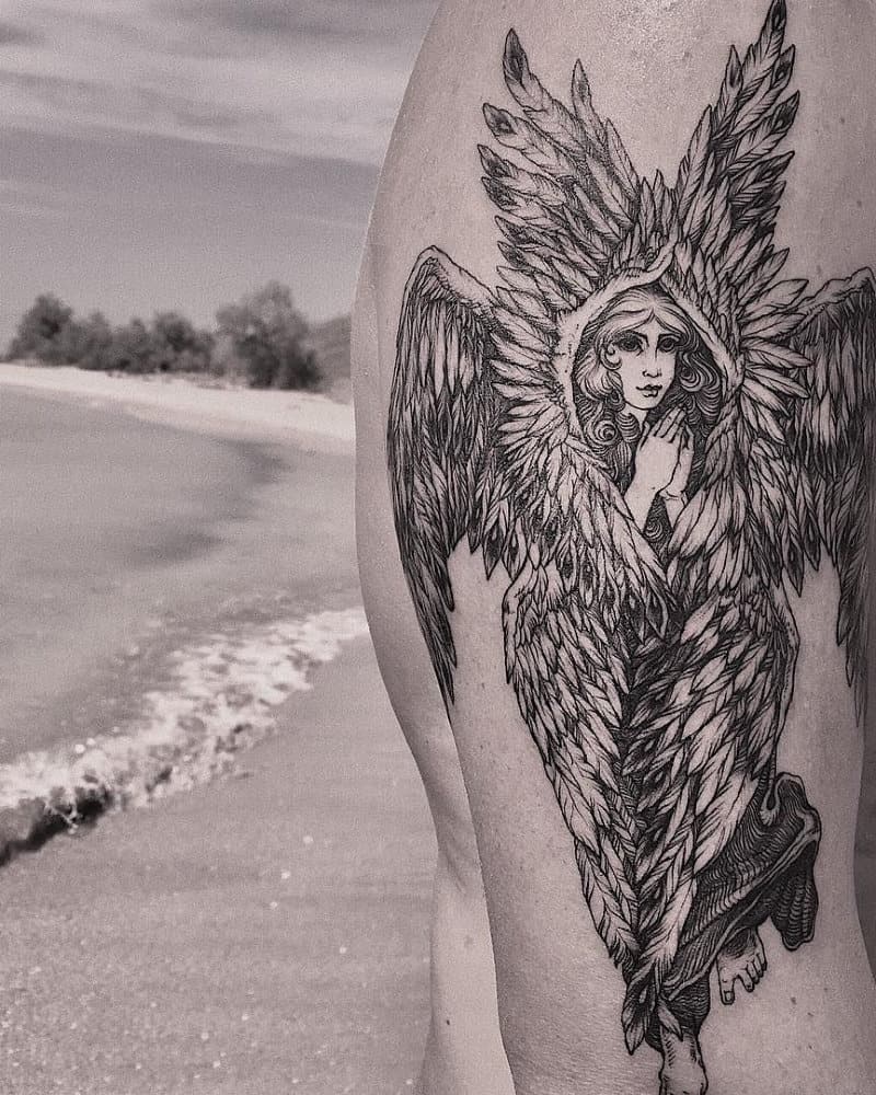 Tattoo of a six-winged angel with a praying expression