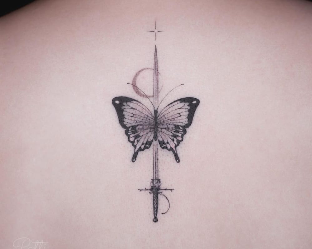 Tattoo of a sword and a butterfly
