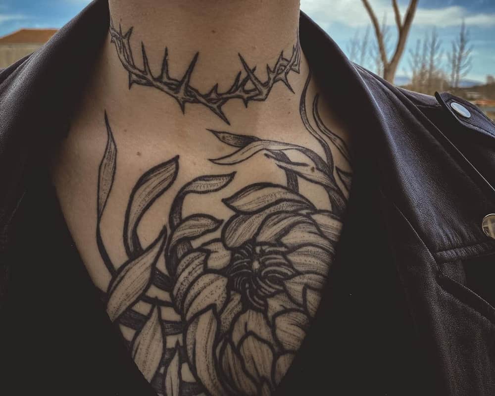 Tattoo of a wreath of thorns on the neck and a large flower on the chest