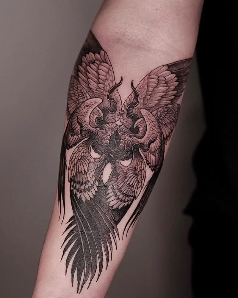 Tattoo of an angel with eight crane wings and horns