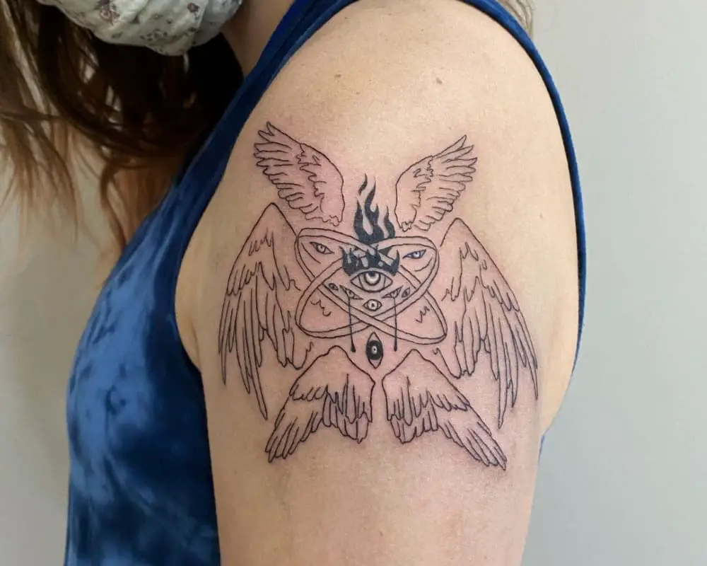 Tattoo of an angel with rings of nine eyes and six wings with a flaming eye in the centre