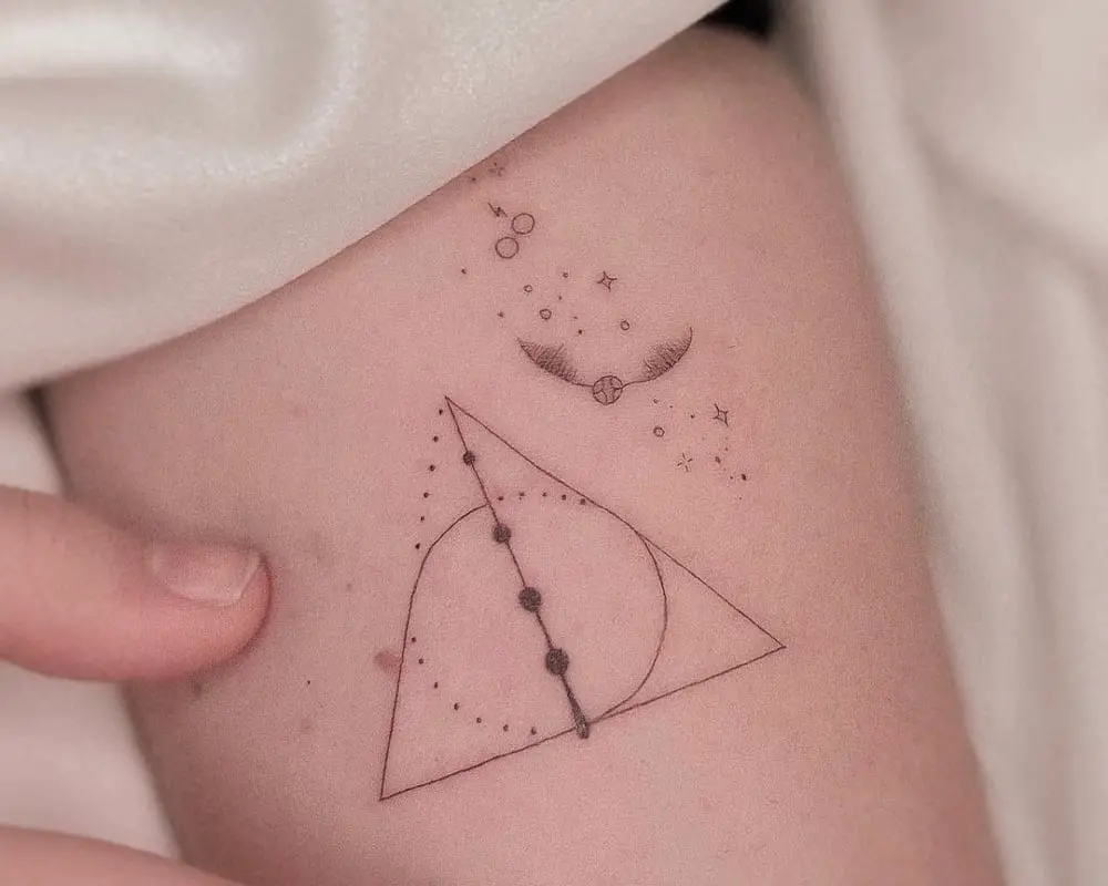 Tattoo of the Deathly Hallows, glasses and a golden snitch