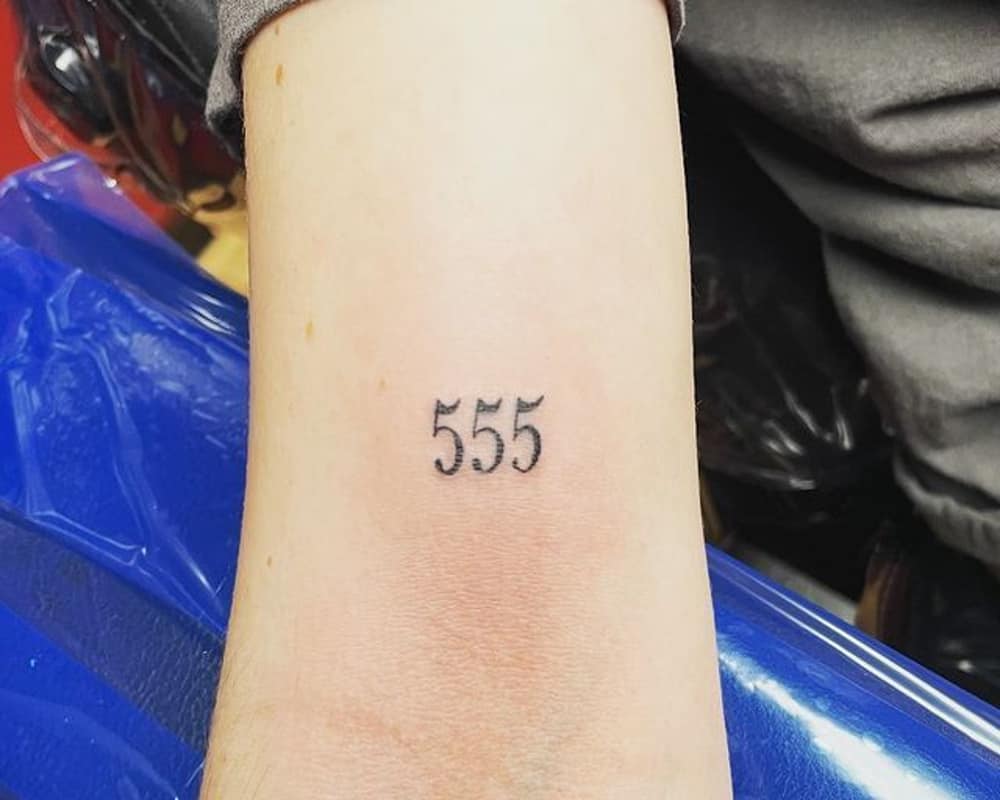 Tattoo of three fives on the hand
