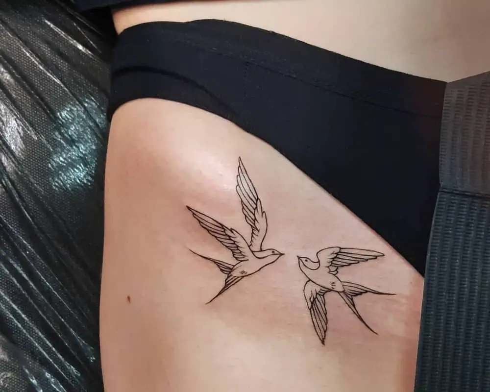 Tattoo of two swallows