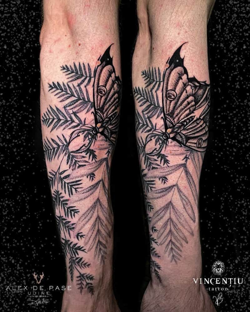Tattoo on two hands with a cicada and leaves