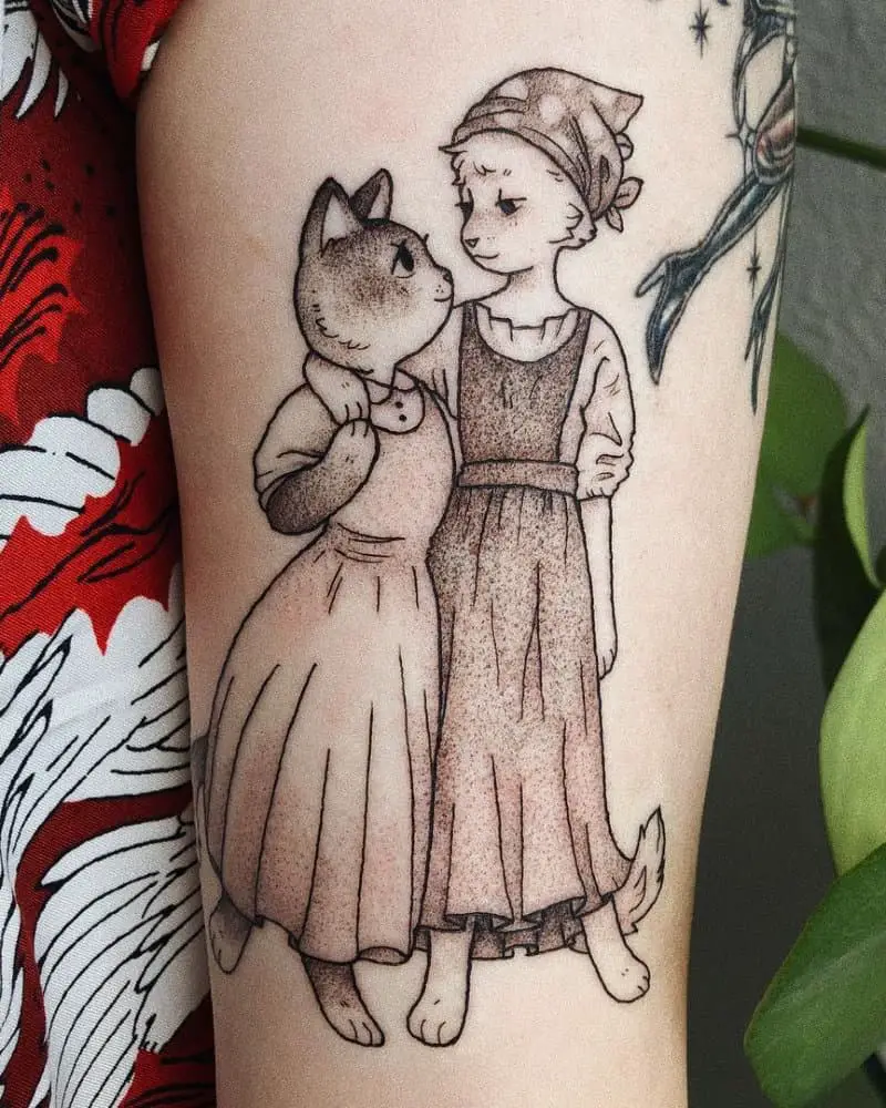 Tattoos featuring cuddling cats in dresses