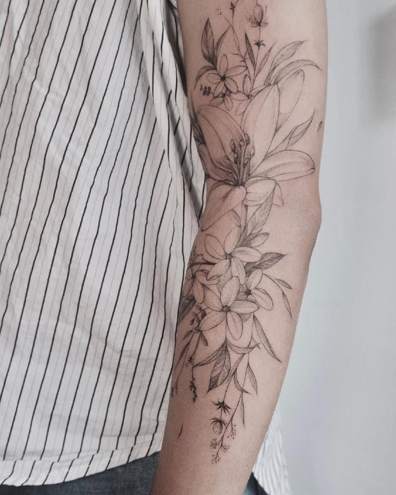Tattoos in the form of a large lily branch