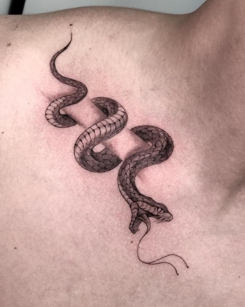 Tattoos in the form of a snake wrapped around the collarbone