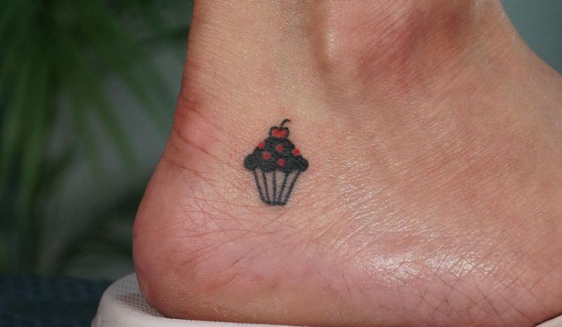 Black and red cupcake tattoo