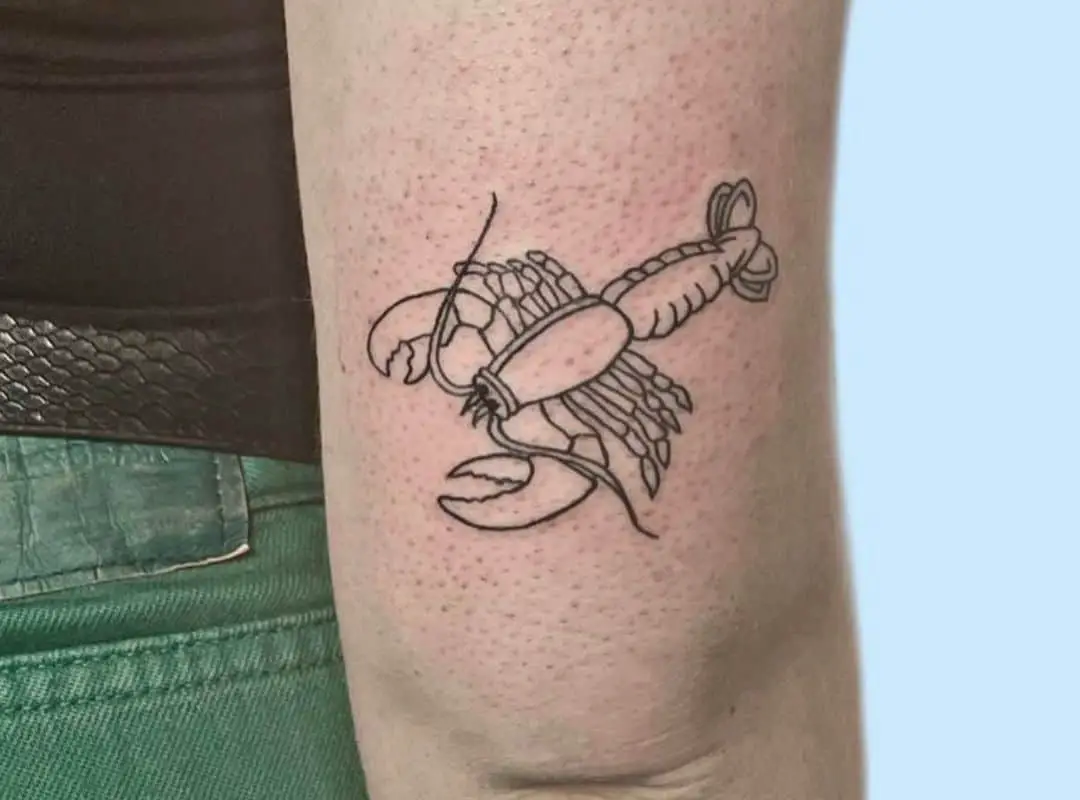 Tiny outline lobster tattoo near the elbow