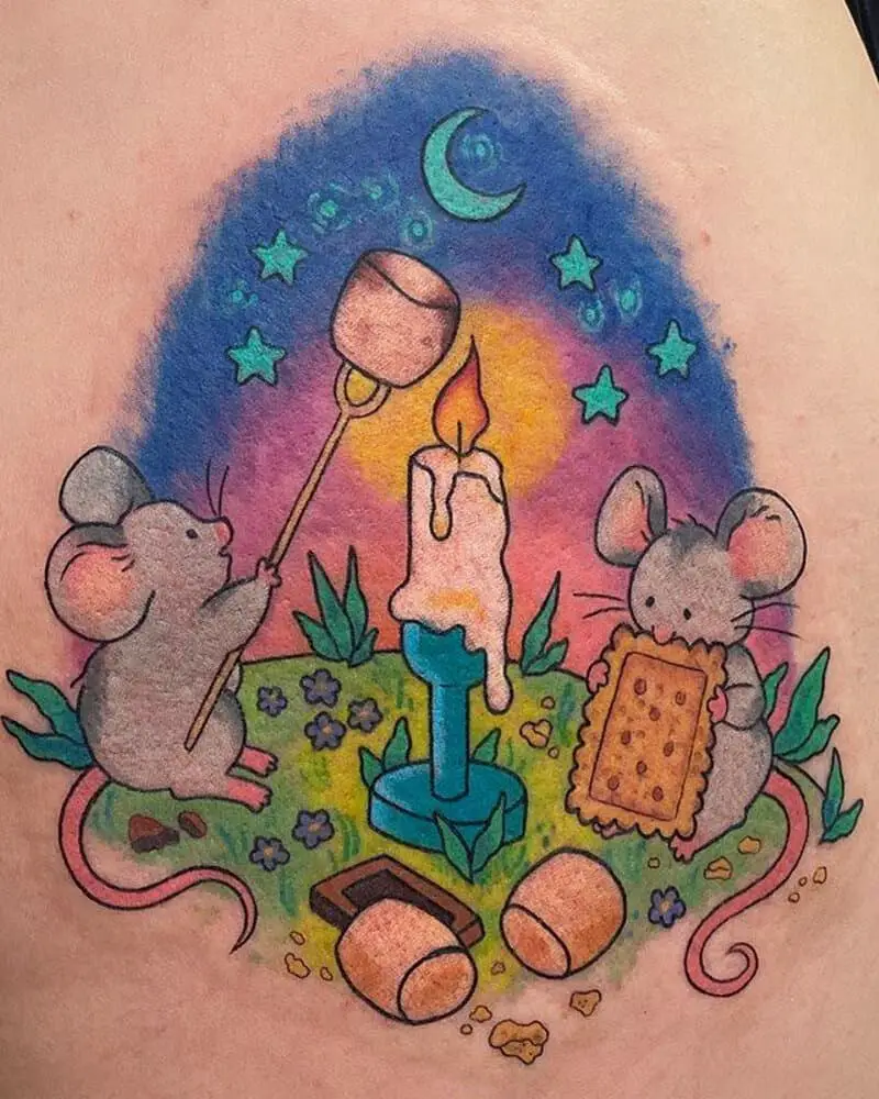 a colourful tattoo of two mice eating sweets by a candle
