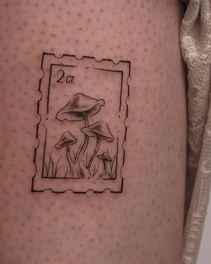 a postage stamp tattoo with mushrooms