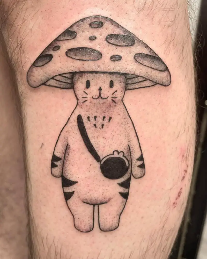 a small tattoo in the shape of a mushroom cat