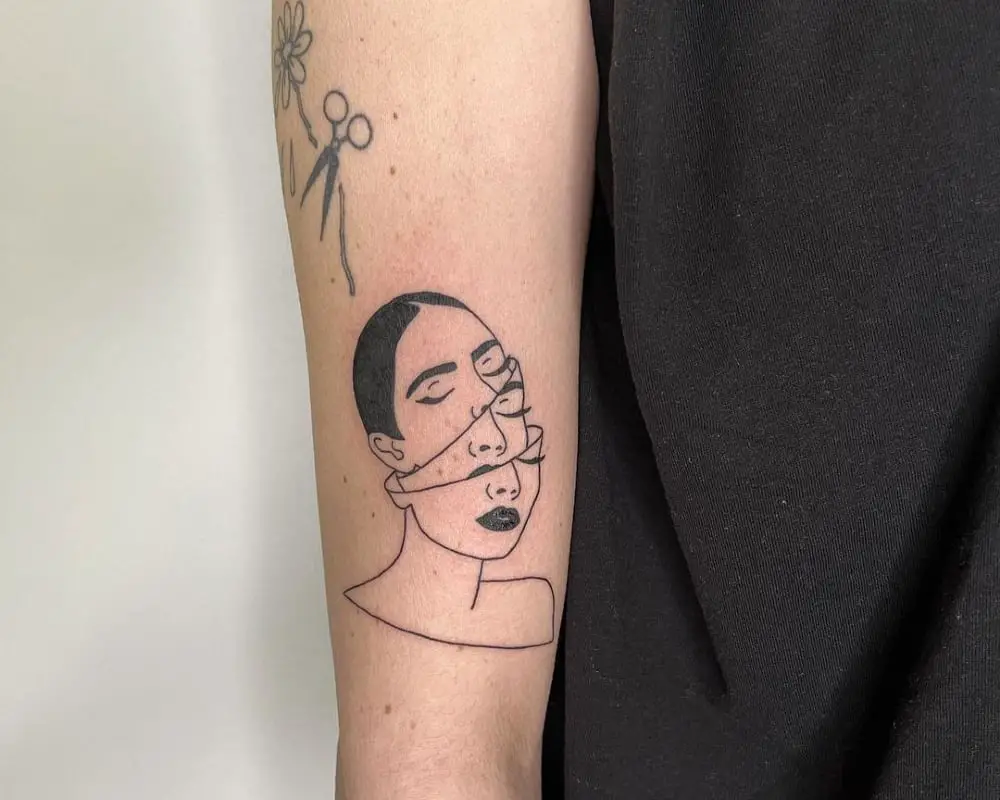 a tattoo in the form of a head with another head inside it