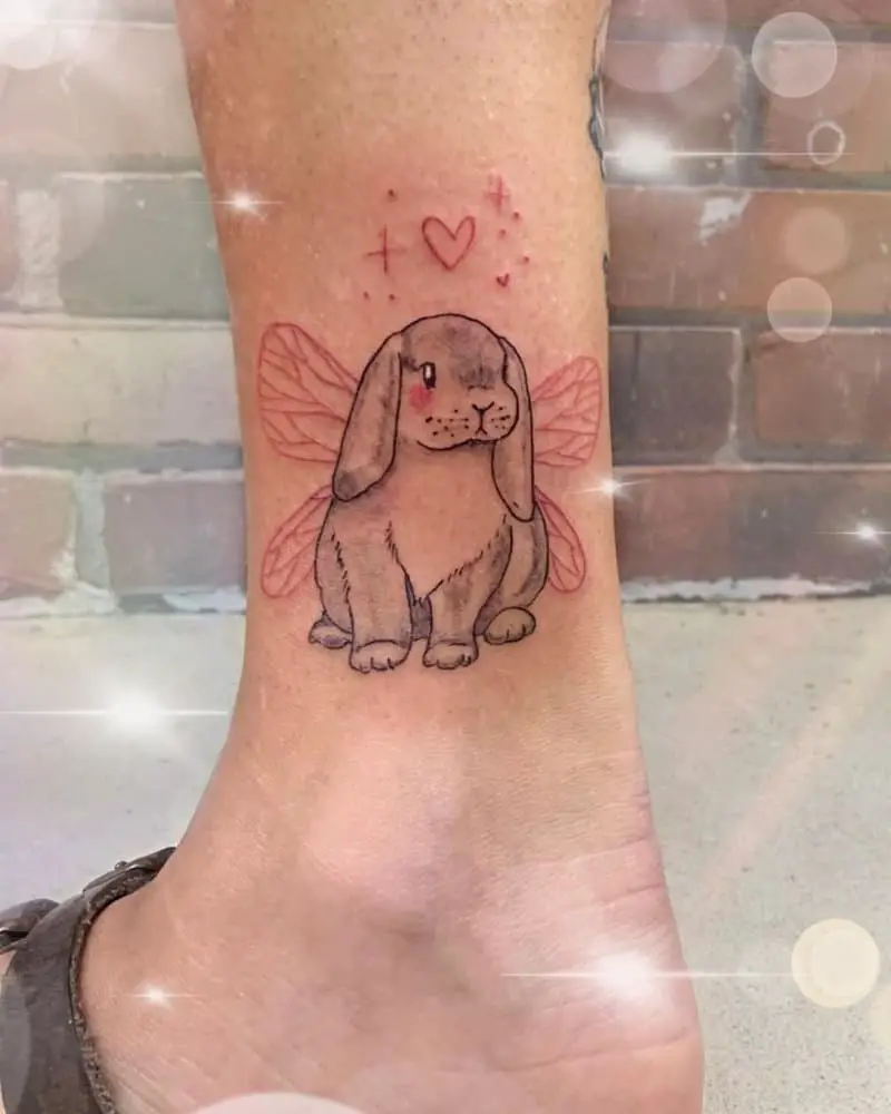 a tattoo of a rabbit with wings