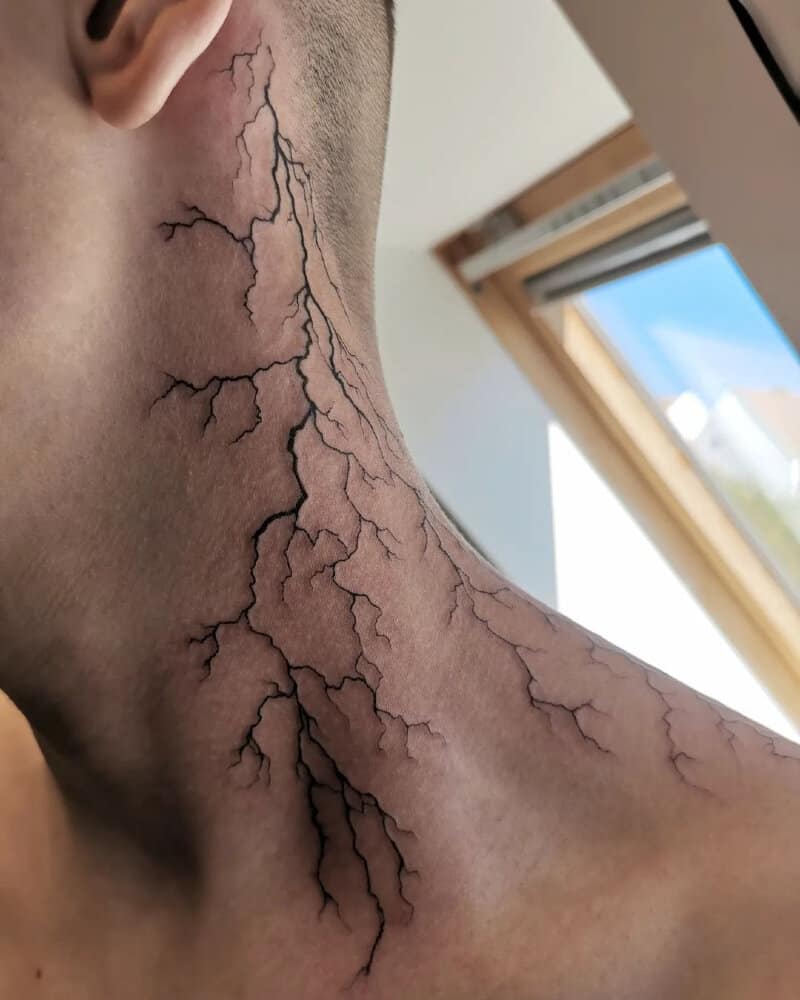 a tattoo of a zip mark on the neck