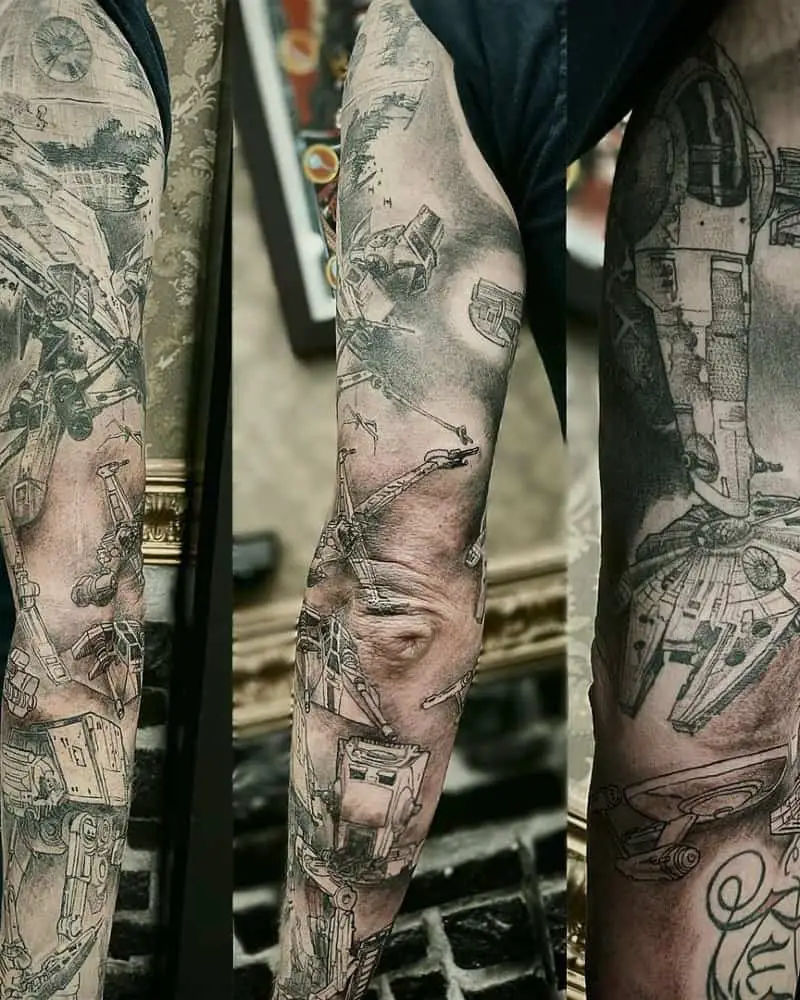 black and white full sleeve tattoo with Empire and Rebel starships