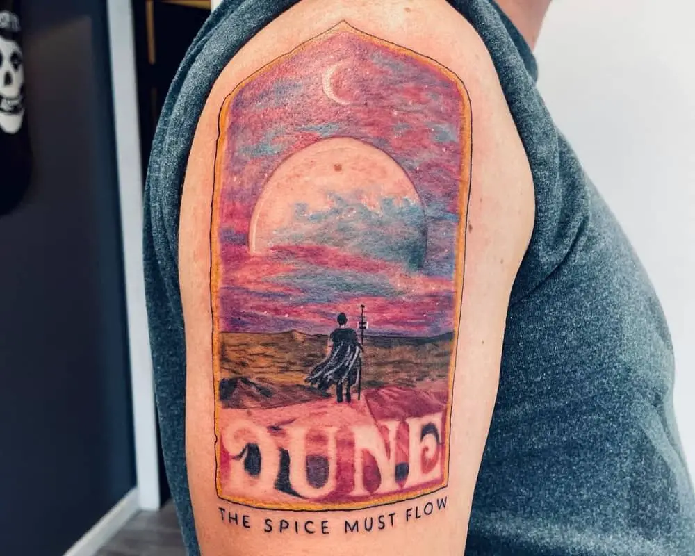 colored tattoo of a man against the desert and the inscription Duna the spice must flow