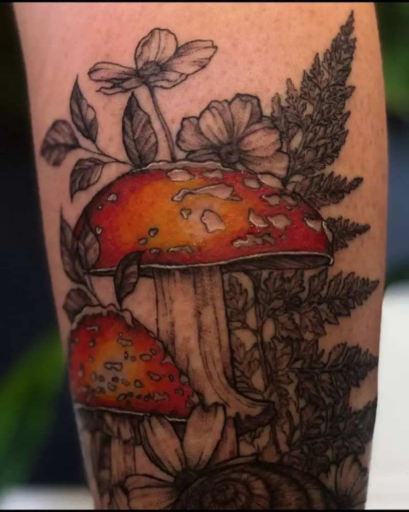 coloured tattoo with mushrooms and flowers