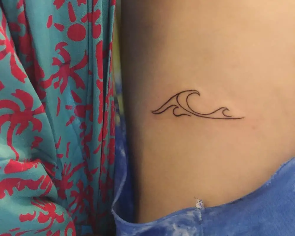 small tattoo in the form of waves
