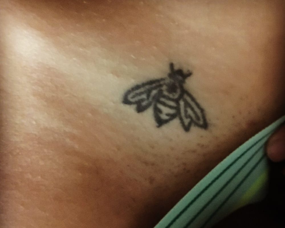 small tattoo of a bee