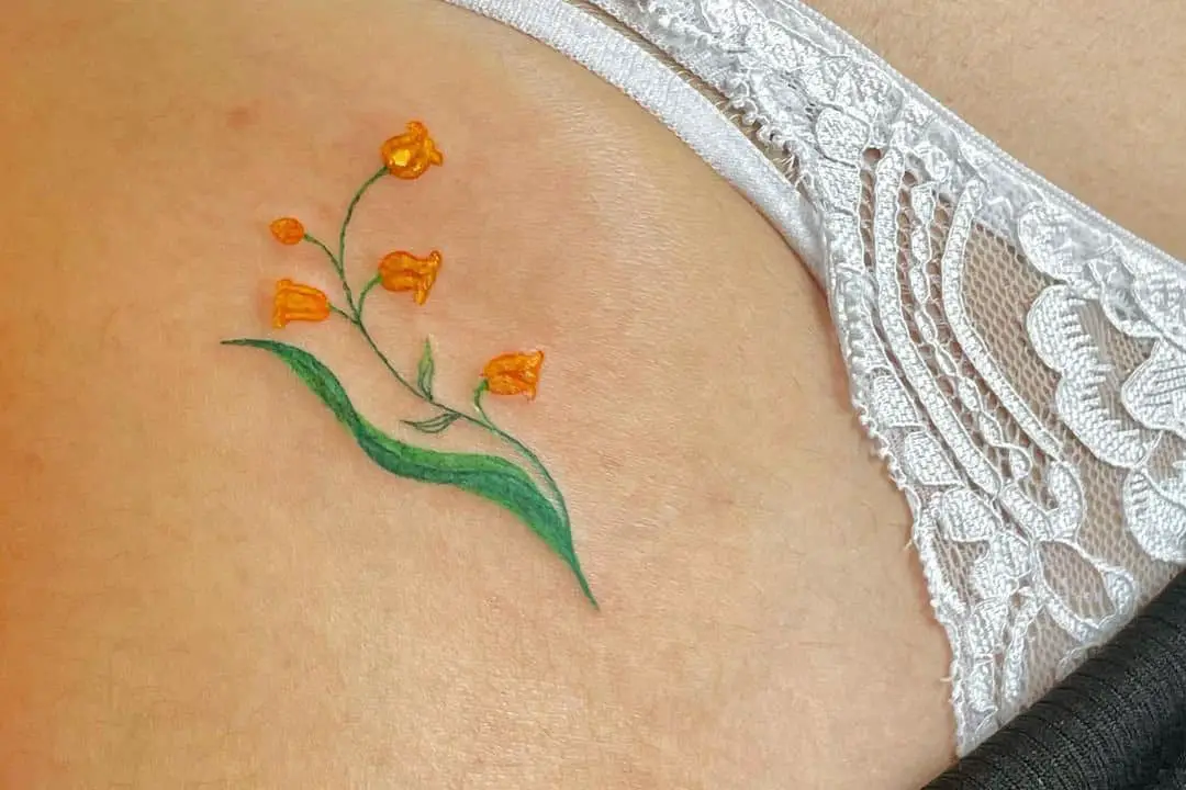 small tattoo of a flower branch