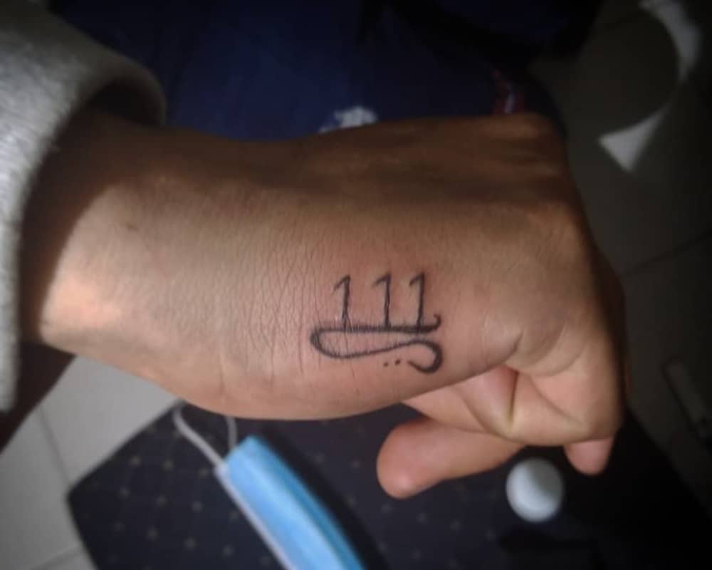 tattoo 111 with a line