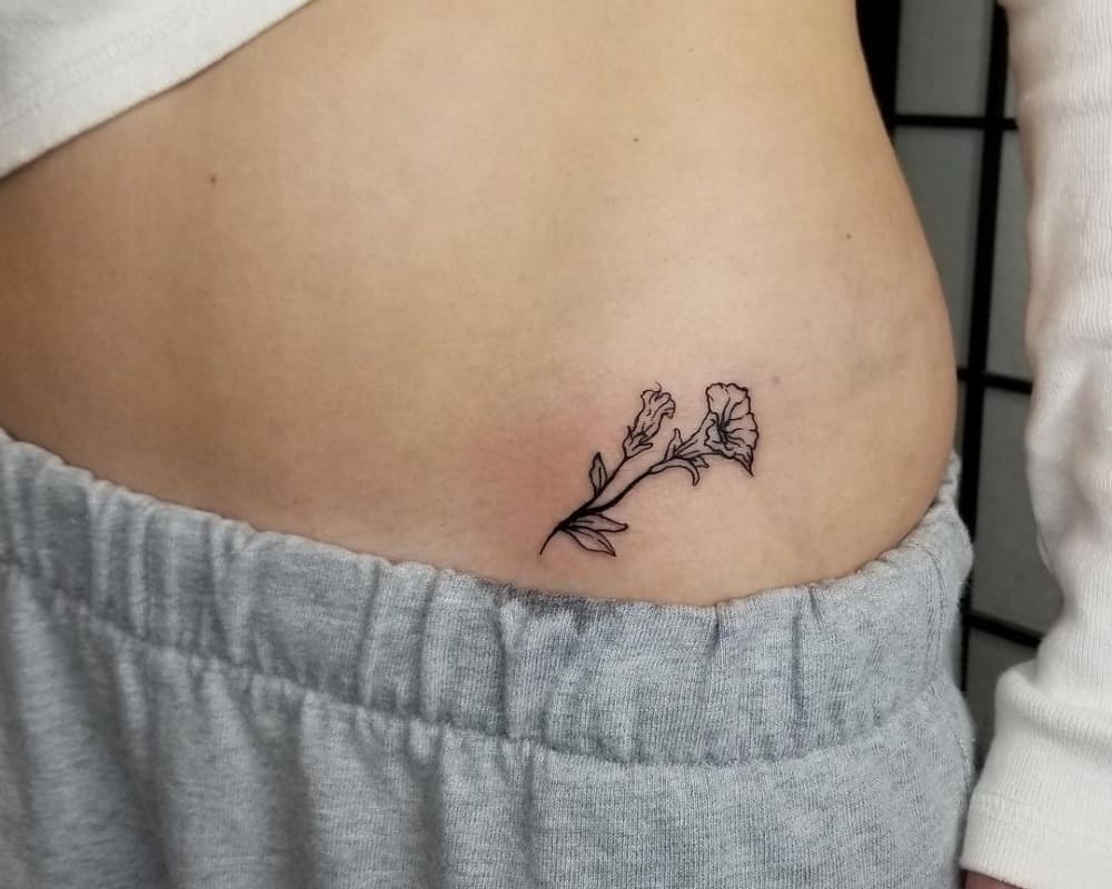 tattoo a twig of a beautiful flower
