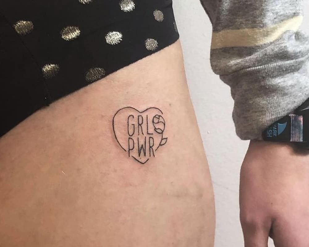 tattoo in the form of a heart and the inscription GRL PWL