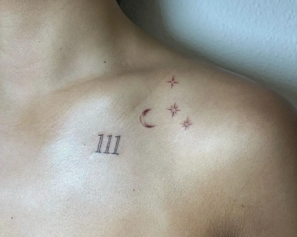 tattoo of 111 and stars on the shoulder