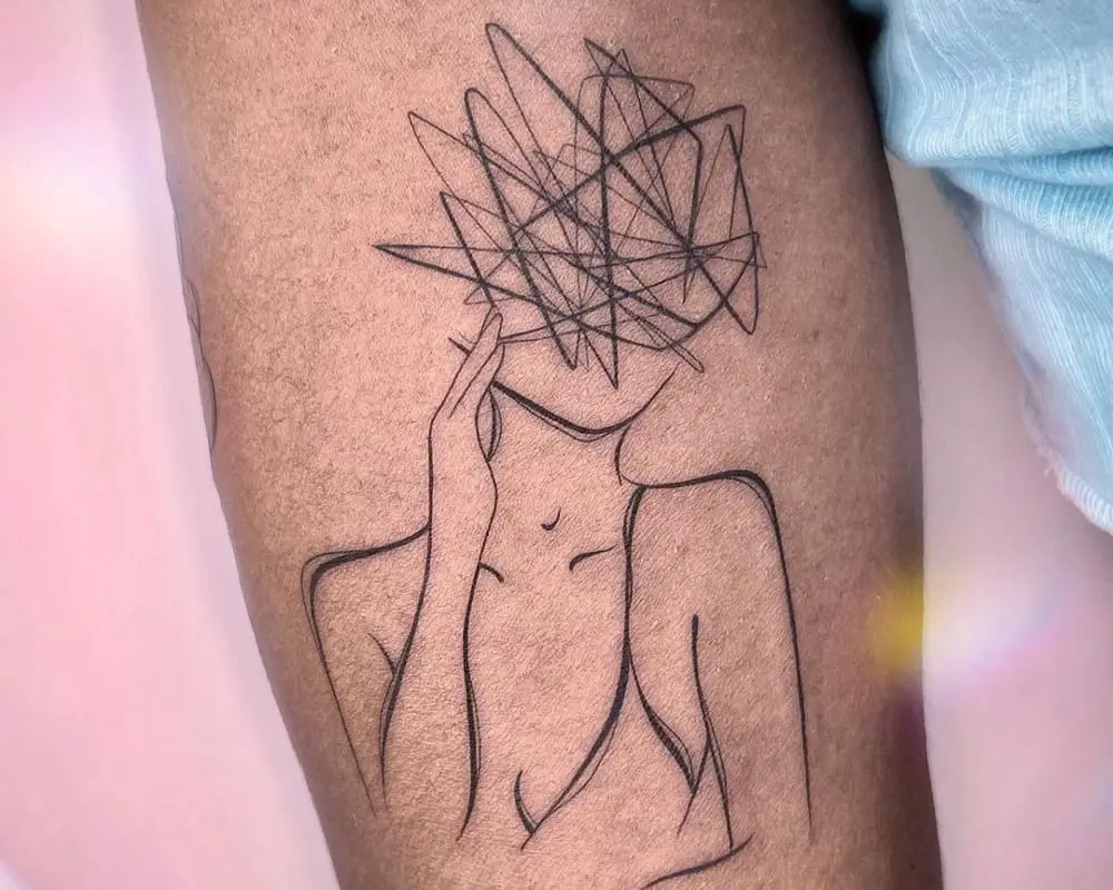 tattoo of a beautiful female silhouette with confused thoughts instead of a head