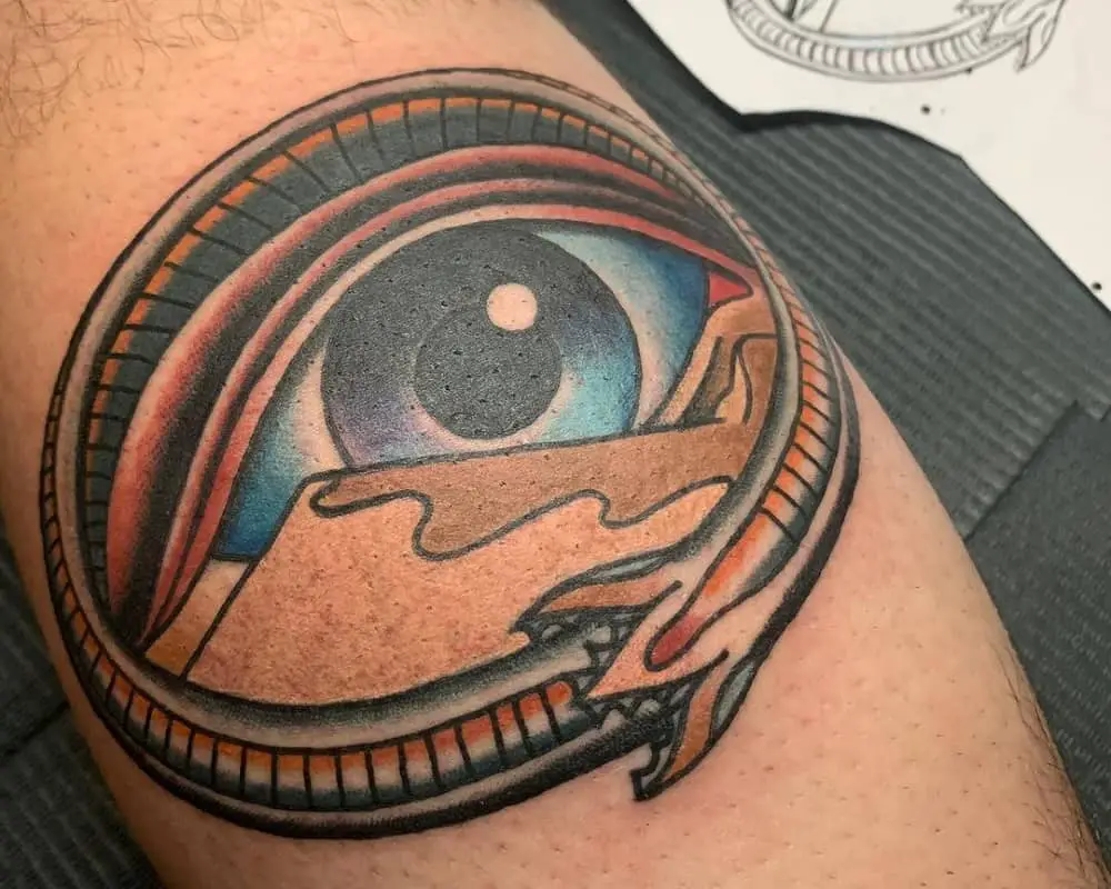 tattoo of a blue eye in the desert