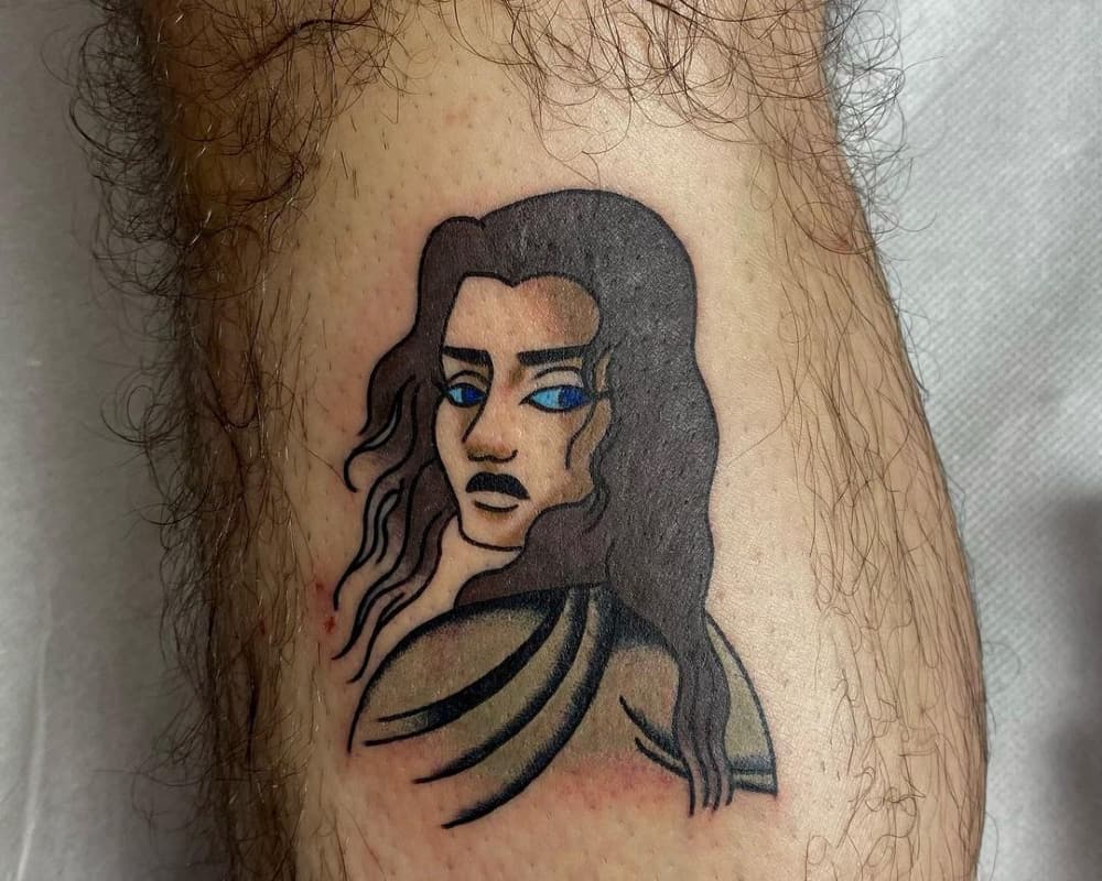 tattoo of a girl with blue eyes