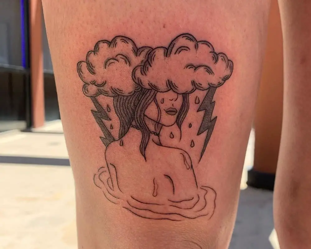 tattoo of a silhouette of a girl in thunderclouds