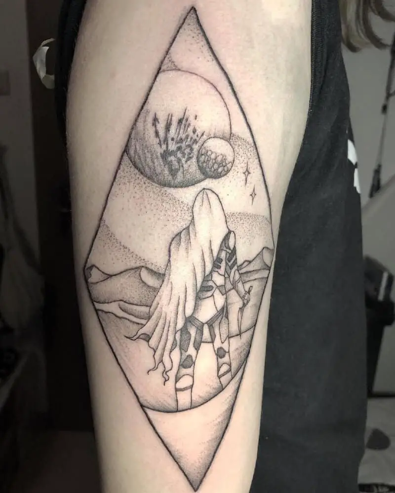 tattoo of a warrior on the background of moons in a rhombus