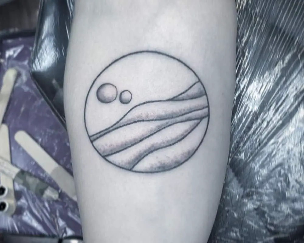 tattoo of desert with moons in a circle