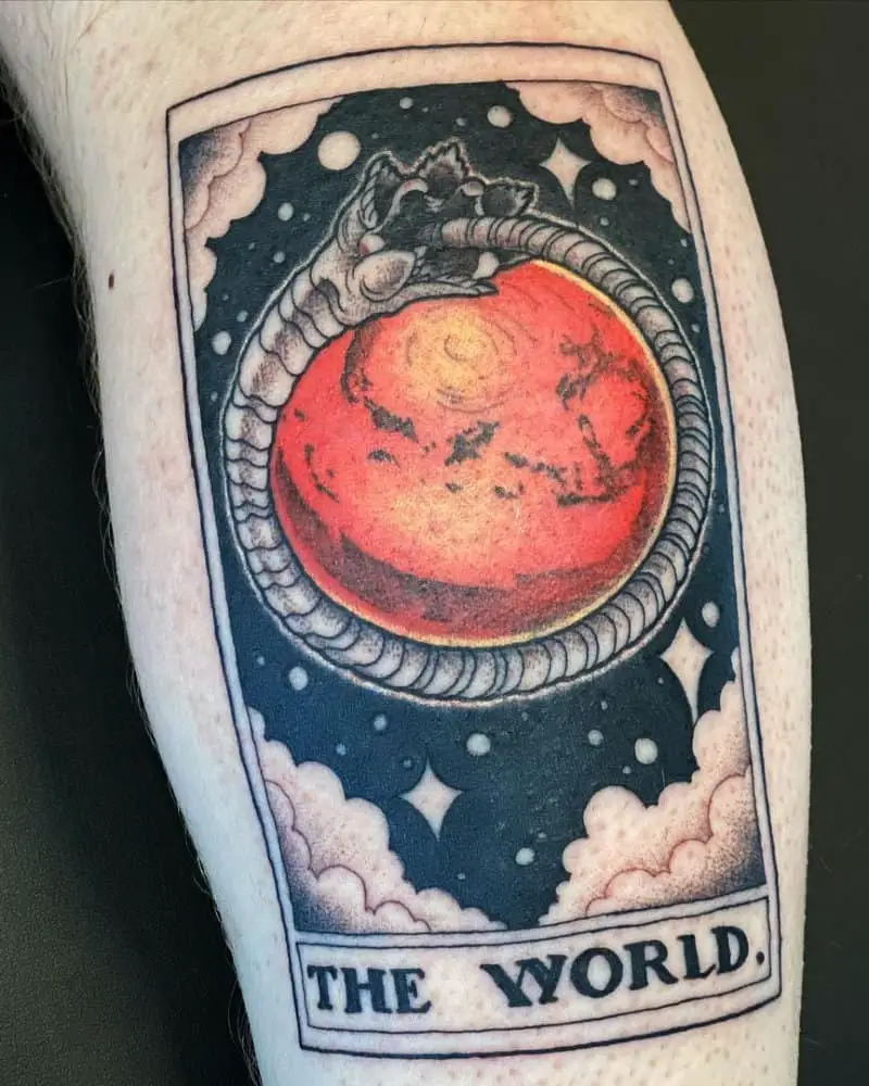 tattoo of tarot card with planet Arrakis and Sandworm