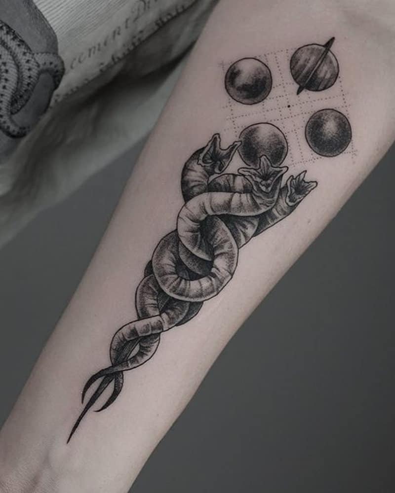 tattoo of three intertwined sand worms