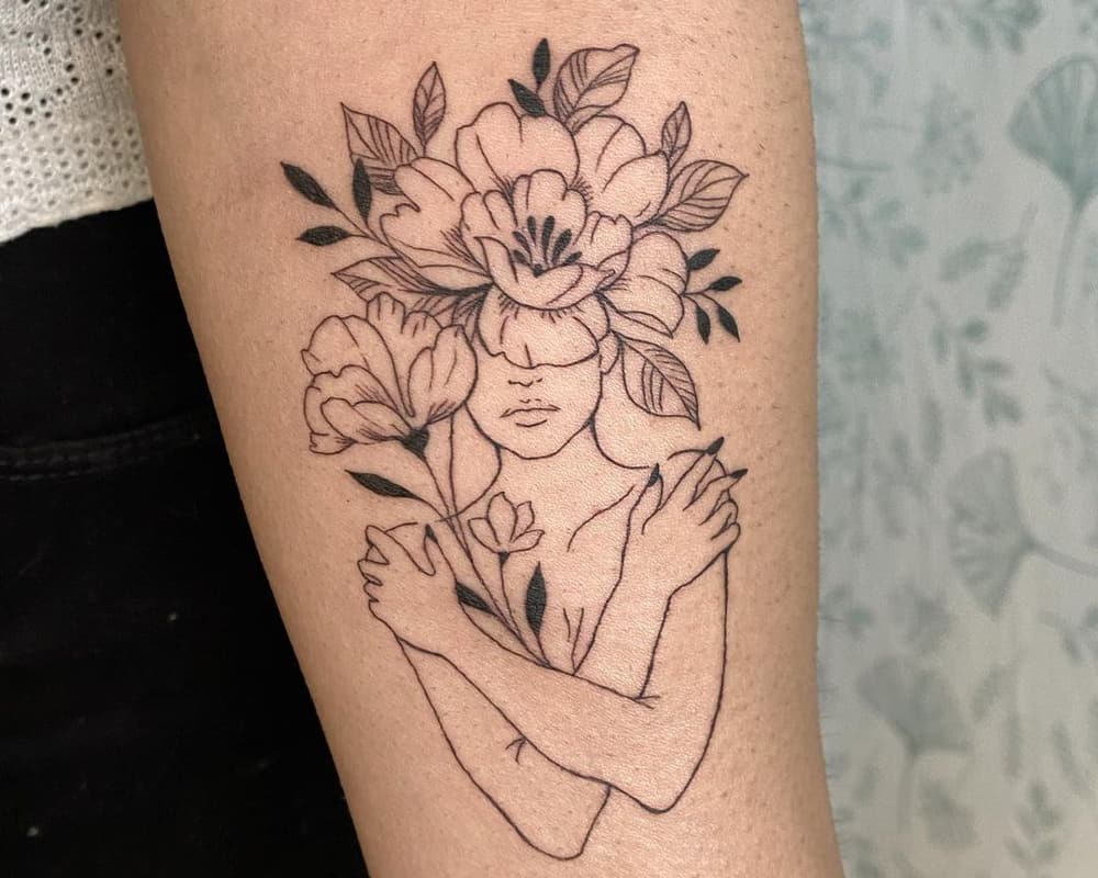 tattoo silhouette of a girl in flowers