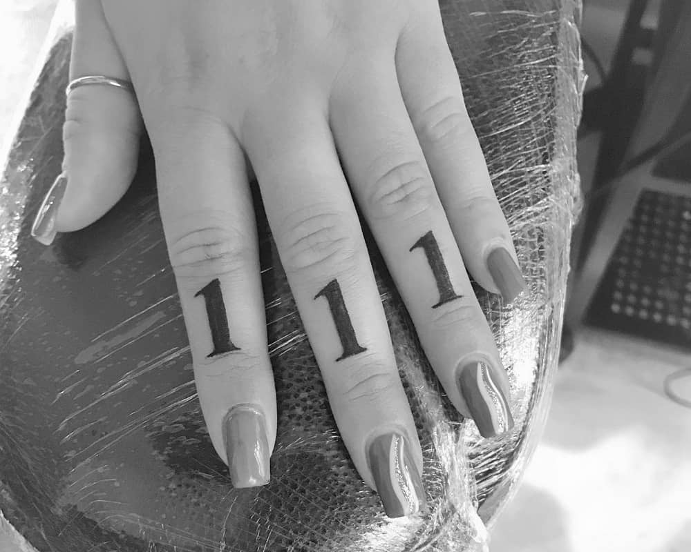 111 tattoos on separate fingers