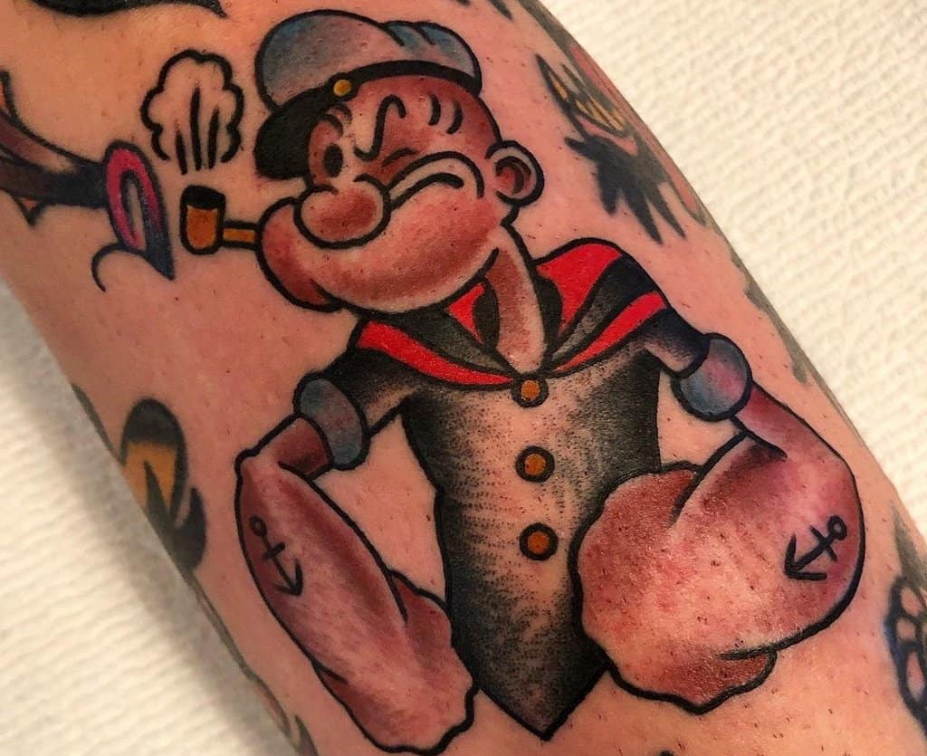 colored Popeye sailor tattooed on the forear