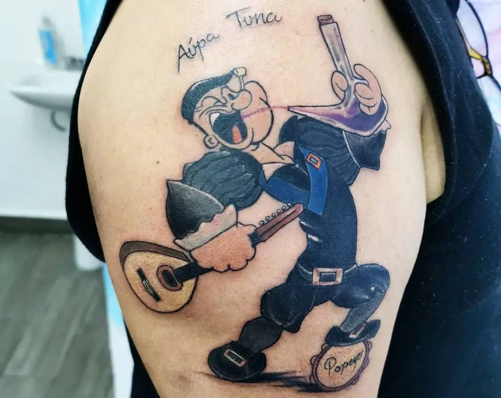 Popeye sailor tattoo with guitar
